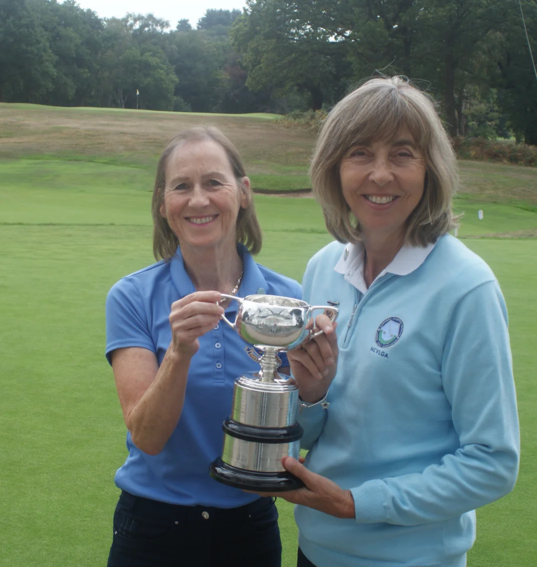 Jane receives Richardson Trophy from Caroline